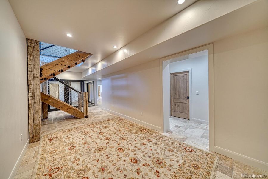 The walk-out lower level offers 9-foot ceilings and is built for wellness, recreation, and extended guest comfort. The walk-out lower level offers 9-foot ceilings and is built for wellness, recreation, and extended guest comfort.