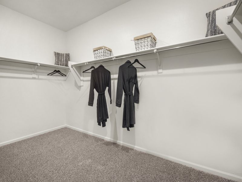 There's plenty of room for your wardrobe in this walk-in primary closet.