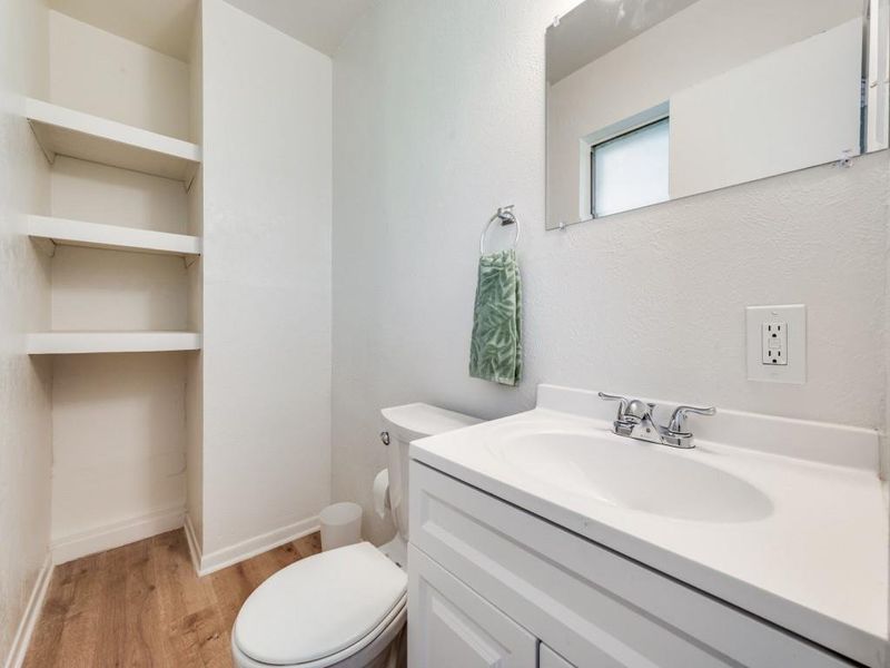 Bathroom with light wood-style floors and vanity Bathroom with light wood-style floors and vanity