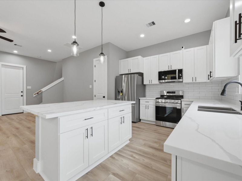 With ample prep space and storage, the kitchen is well-equipped for everything from weeknight dinners to weekend hosting. With ample prep space and storage, the kitchen is well-equipped for everything from weeknight dinners to weekend hosting.
