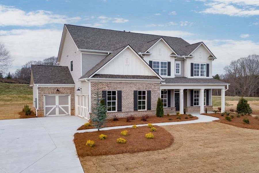Front exterior of a new home in , Gainesville, GA, highlighting curb appeal (Image 2). Front exterior of a new home in , Gainesville, GA, highlighting curb appeal (Image 2).