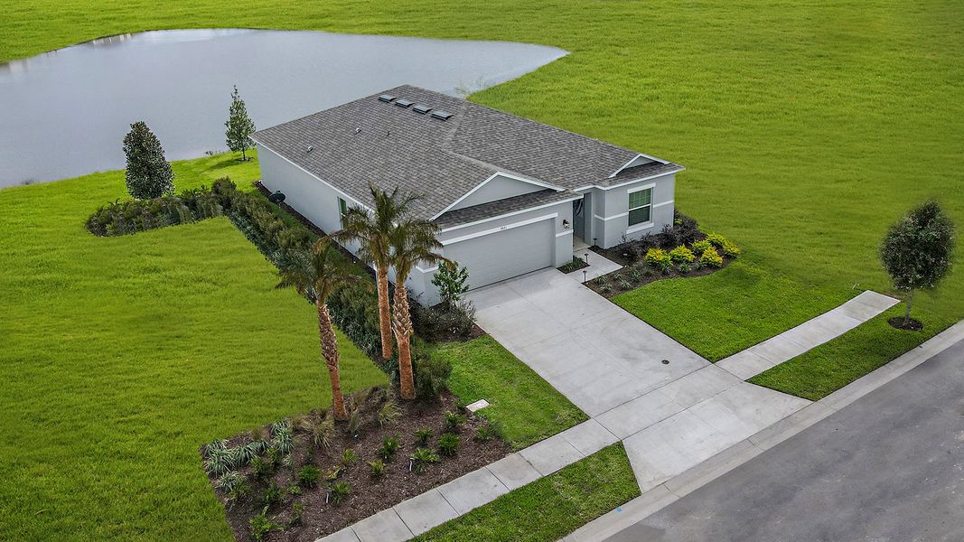 Representative exterior photo of a completed home built from the Goldfinch by Taylor Morrison in Solena, North Fort Myers, FL (Image 6).