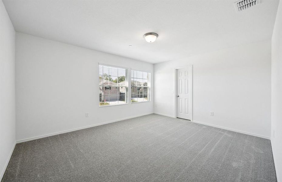 Spacious secondary bedroom with large windows