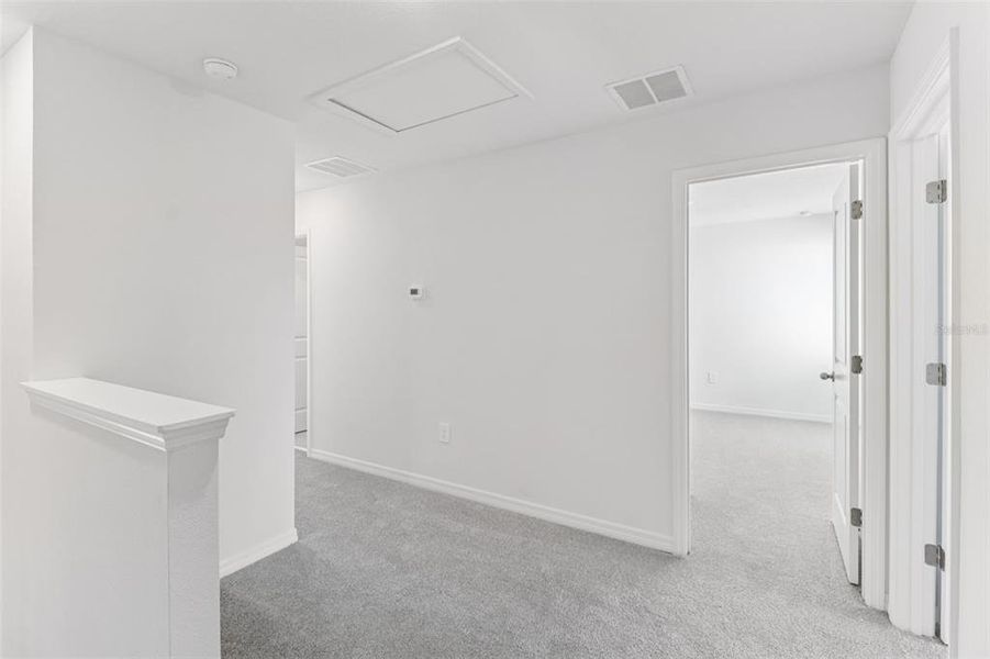 Spacious, unfurnished interior of a new home in The Reserve at Hammock Oaks Townes, Lady Lake (Image 17).