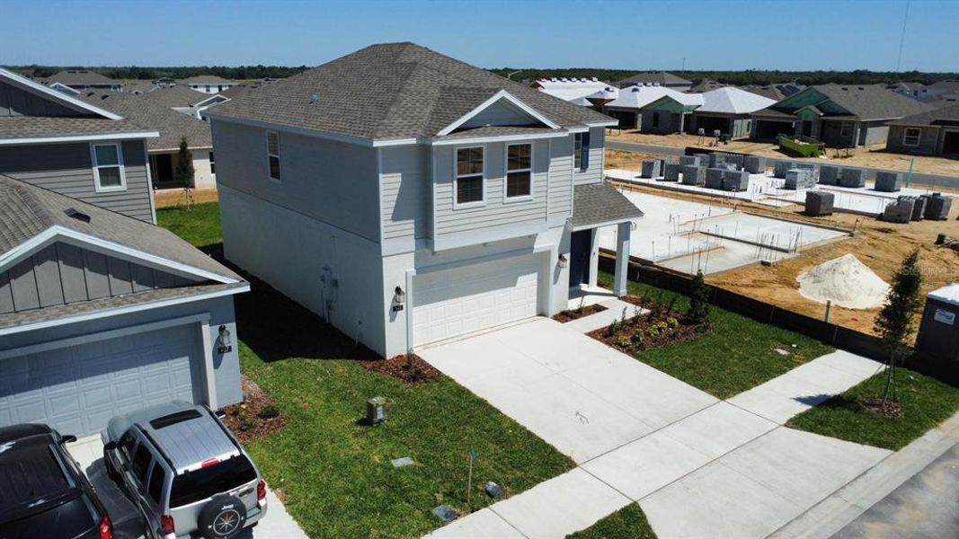 Front exterior of a new home in Lawson Dunes, Haines City, FL, highlighting curb appeal (Image 20).