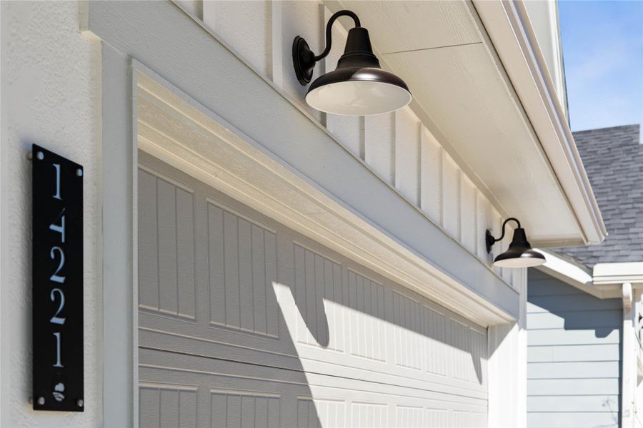 The property features stylish matte black gooseneck barn lights - providing ample illumination for safety and ambiance. The property features stylish matte black gooseneck barn lights - providing ample illumination for safety and ambiance.