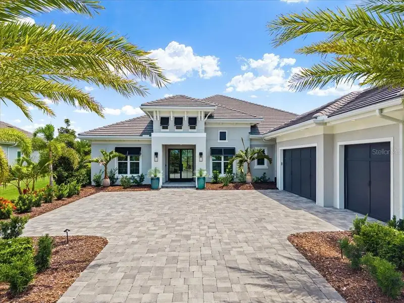 Front exterior of a new home in , Lakewood Ranch, FL, highlighting curb appeal (Image 25). Front exterior of a new home in , Lakewood Ranch, FL, highlighting curb appeal (Image 25).