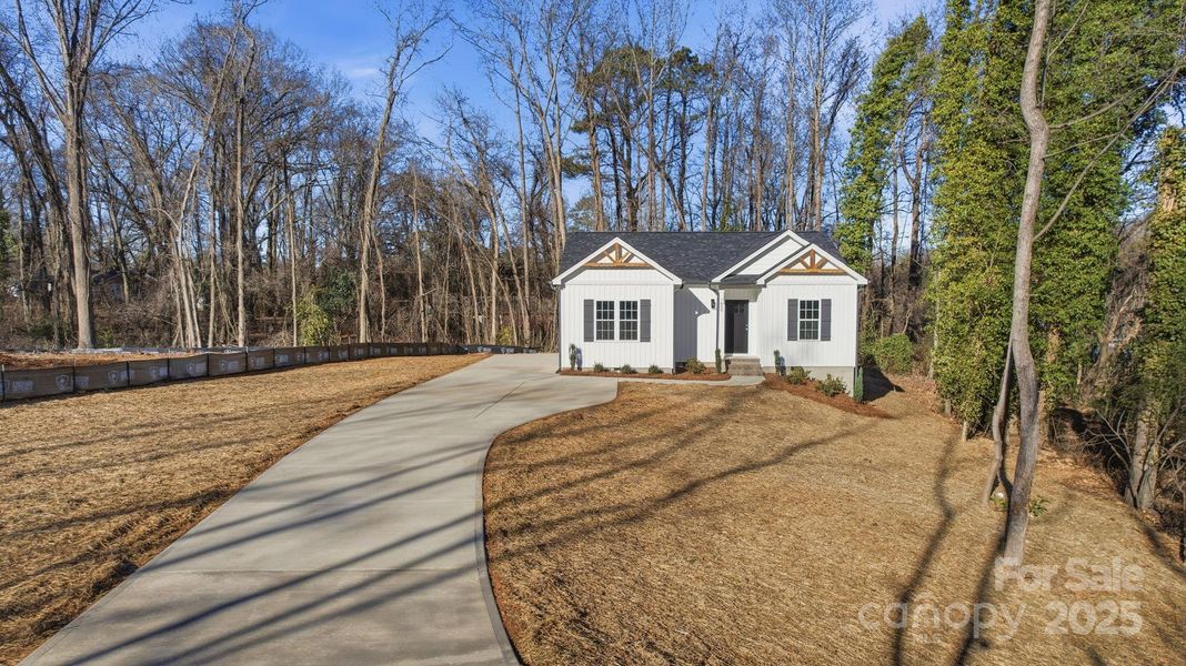 Front exterior of a new home in , Monroe, NC, highlighting curb appeal (Image 17).