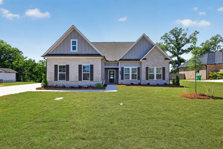 Front exterior of a new home in Riverbend North, Bonaire, GA, highlighting curb appeal (Image 1). Front exterior of a new home in Riverbend North, Bonaire, GA, highlighting curb appeal (Image 1).