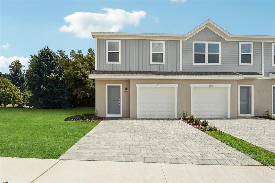Front exterior of a new home in Bimini Bay, Davenport, FL, highlighting curb appeal (Image 1). Front exterior of a new home in Bimini Bay, Davenport, FL, highlighting curb appeal (Image 1).