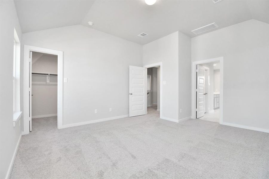 Another view of the primary bedroom. Sample photo of completed home with similar floor plan. As-built interior colors and selections may vary.