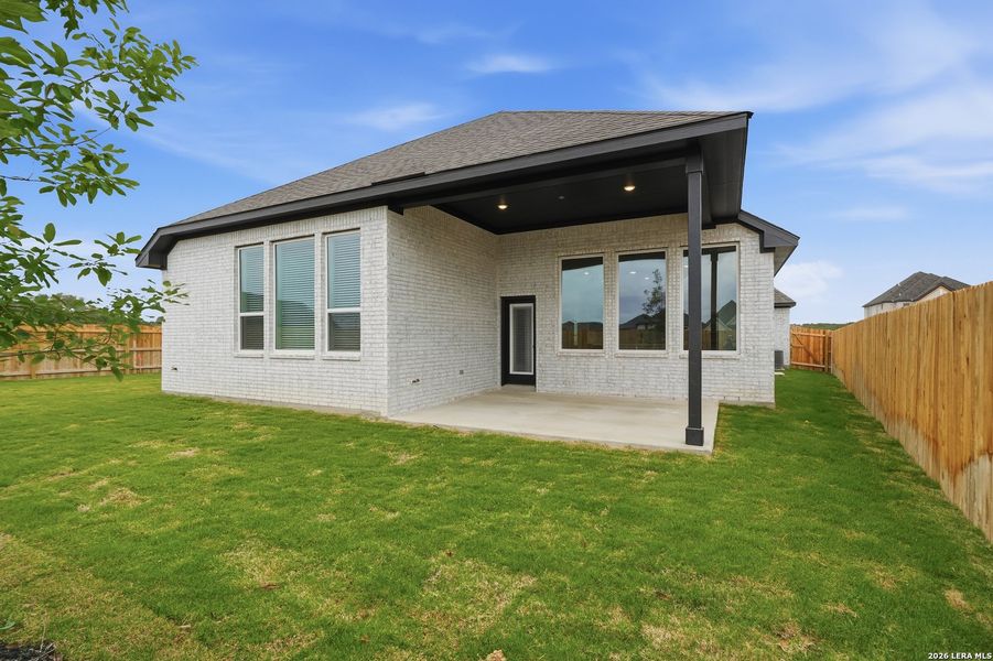 Exterior details and patio area of a home in Alsatian Oaks, Castroville (Image 4).