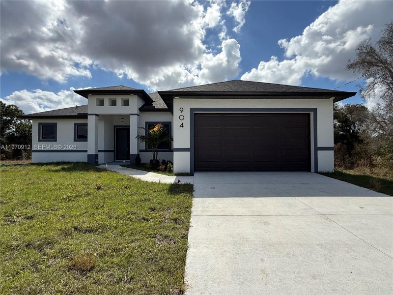 Front exterior of a new home in , Lehigh Acres, FL, highlighting curb appeal (Image 19).