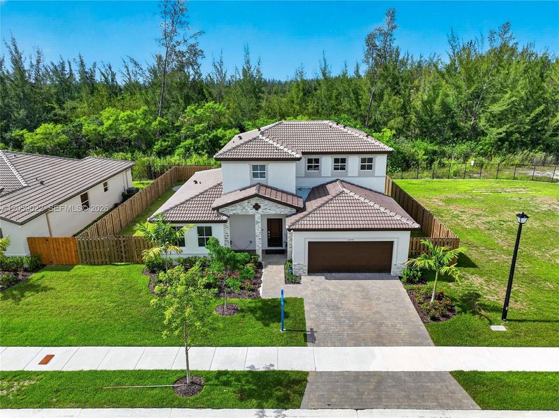 Front exterior of a new home in , Homestead, FL, highlighting curb appeal (Image 30). Front exterior of a new home in , Homestead, FL, highlighting curb appeal (Image 30).