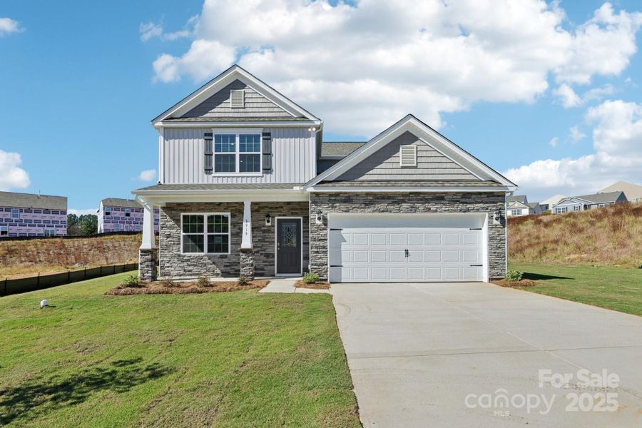 Front exterior of a new home in Cline Village, Conover, NC, highlighting curb appeal (Image 1).