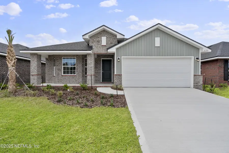 Front exterior of a new home in Shadow Crest at Rolling Hills, Green Cove Springs, FL, highlighting curb appeal (Image 1).
