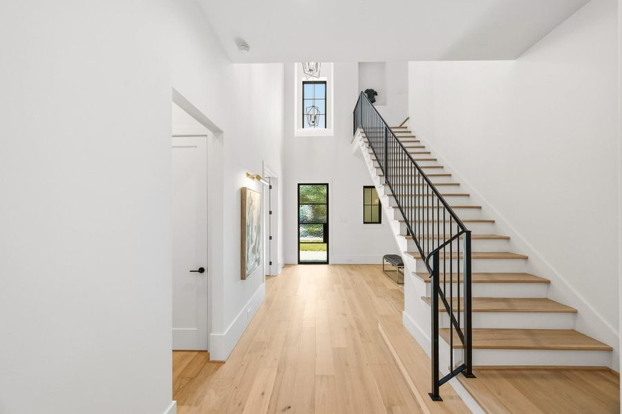 Another look at the spacious foyer shows room under the stairs for a credenza!