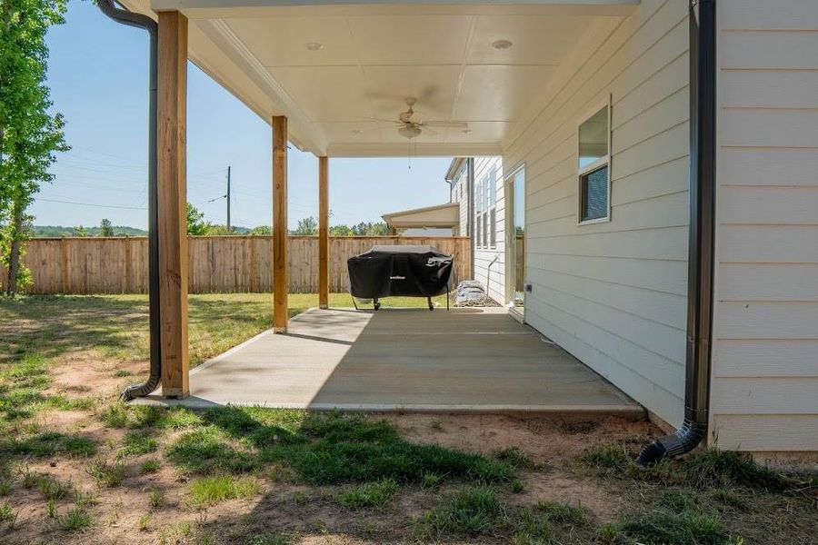 Exterior details and patio area of a home in Park at Ansleigh Farms, Dallas (Image 28).