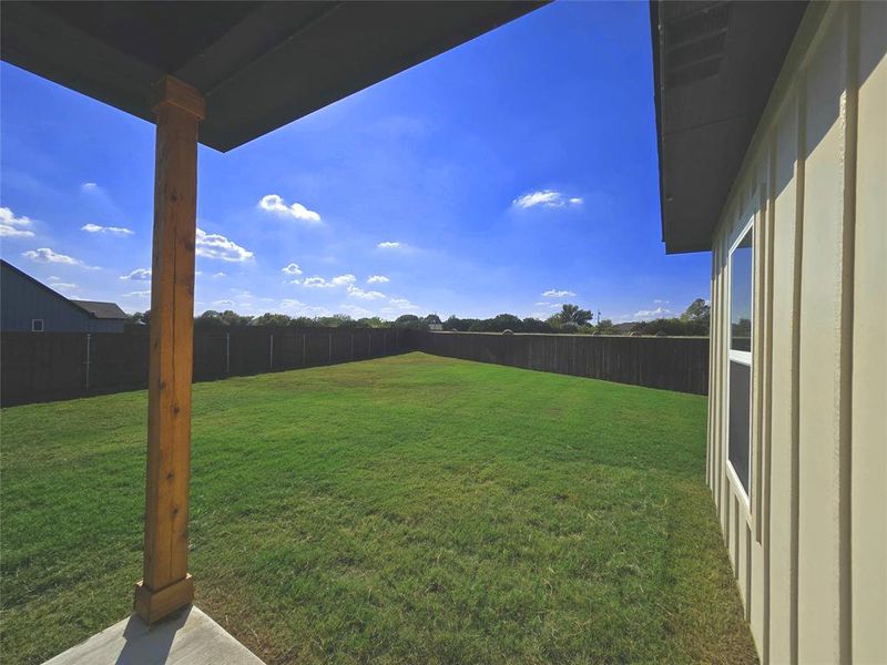 Fenced backyard featuring a patio area Fenced backyard featuring a patio area