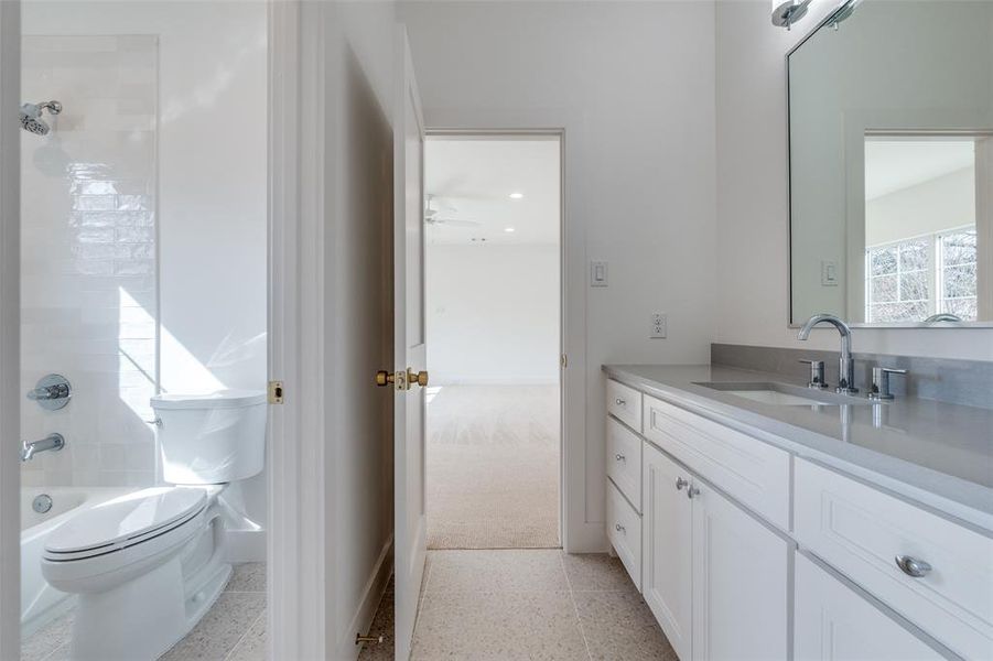 Full bathroom featuring washtub / shower combination, vanity, and toilet