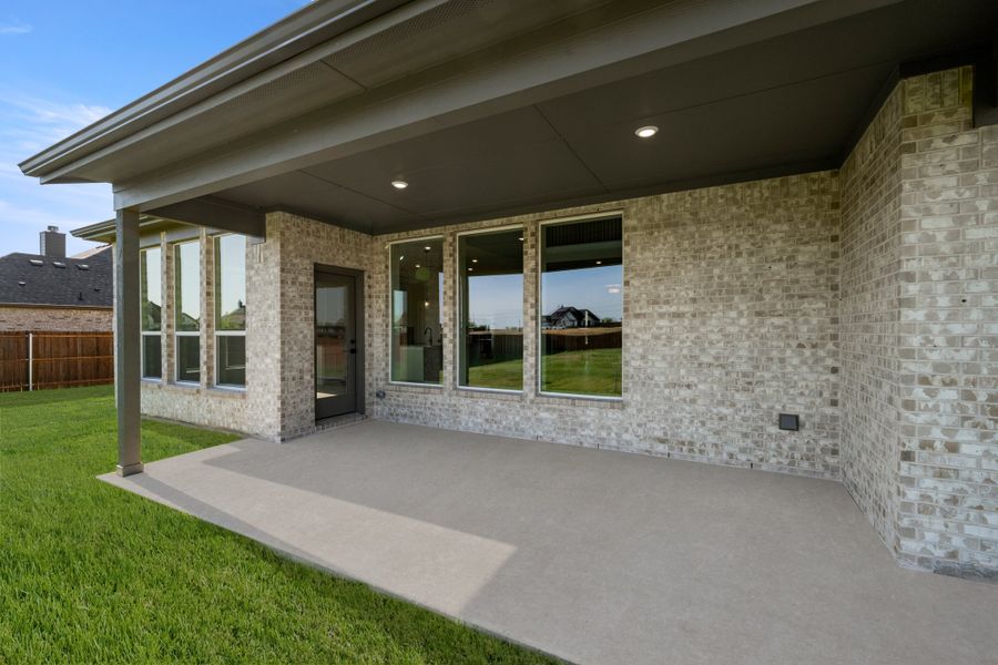 Exterior details and patio area of a home in Coyote Crossing, Godley (Image 3).