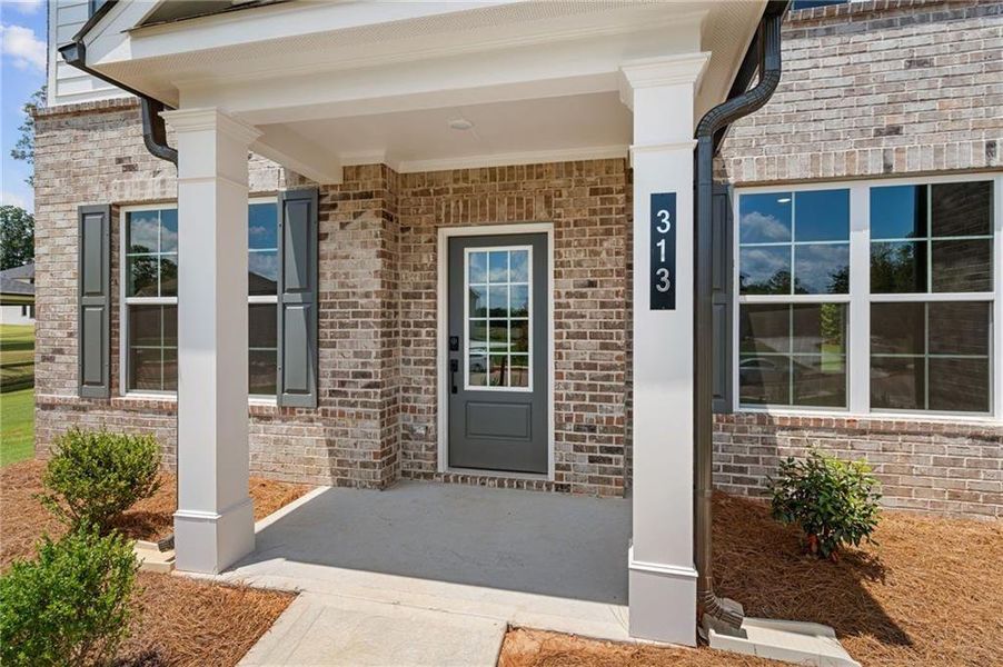 Exterior details and patio area of a home in Windsong Estates, McDonough (Image 4).