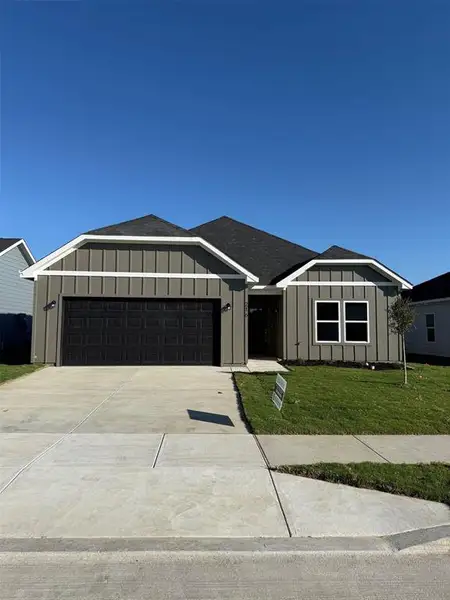 Front exterior of a new home in Trails of Fossil Creek, Fort Worth, TX, highlighting curb appeal (Image 1). Front exterior of a new home in Trails of Fossil Creek, Fort Worth, TX, highlighting curb appeal (Image 1).