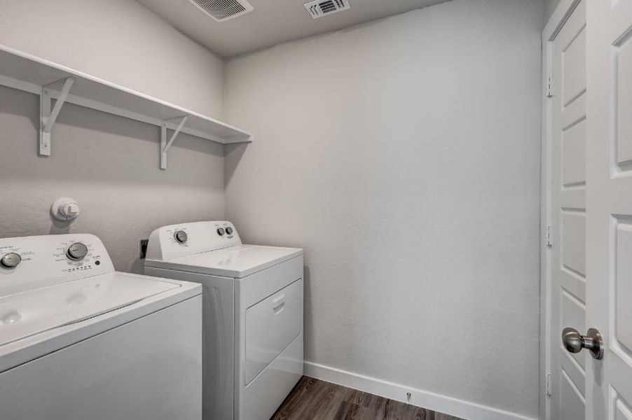 A white room with a washing machine. A white room with a washing machine.