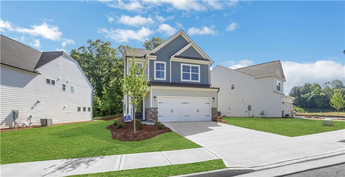 Front exterior of a new home in Villas at Dawsonville, Dawsonville, GA, highlighting curb appeal (Image 24).