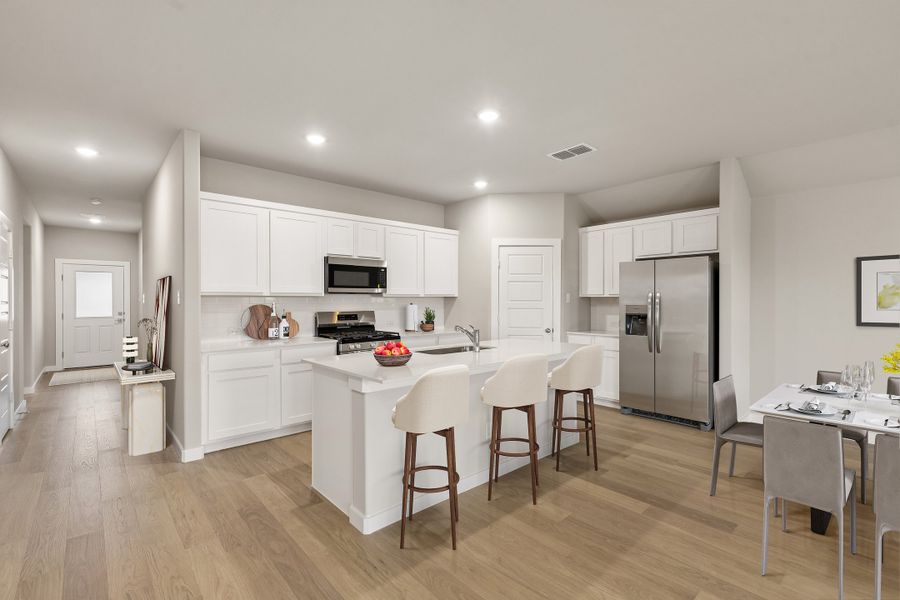 Kitchen in the Emmy II home plan by Trophy Signature Homes - REPRESENTATIVE PHOTO