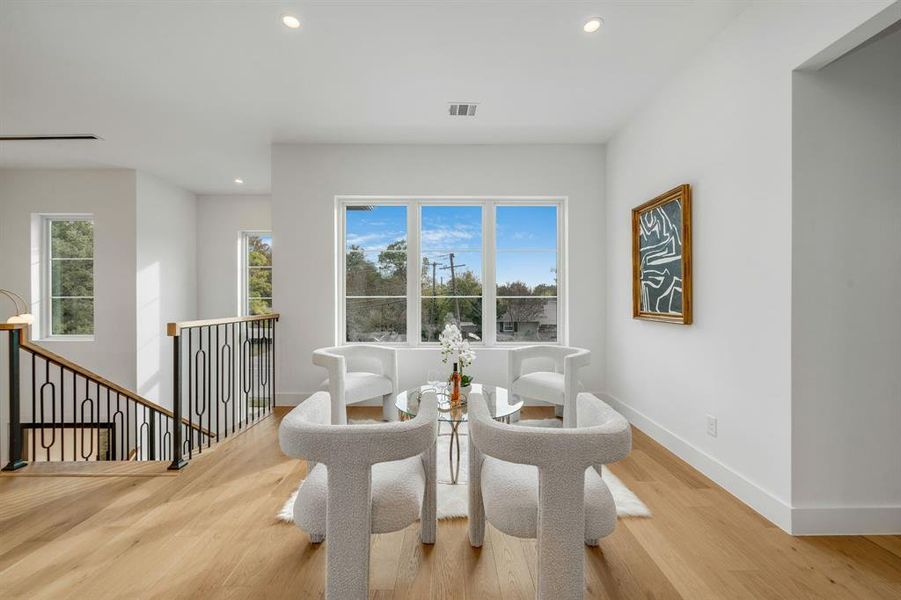 Dining room featuring wood finished floors and recessed lighting Dining room featuring wood finished floors and recessed lighting
