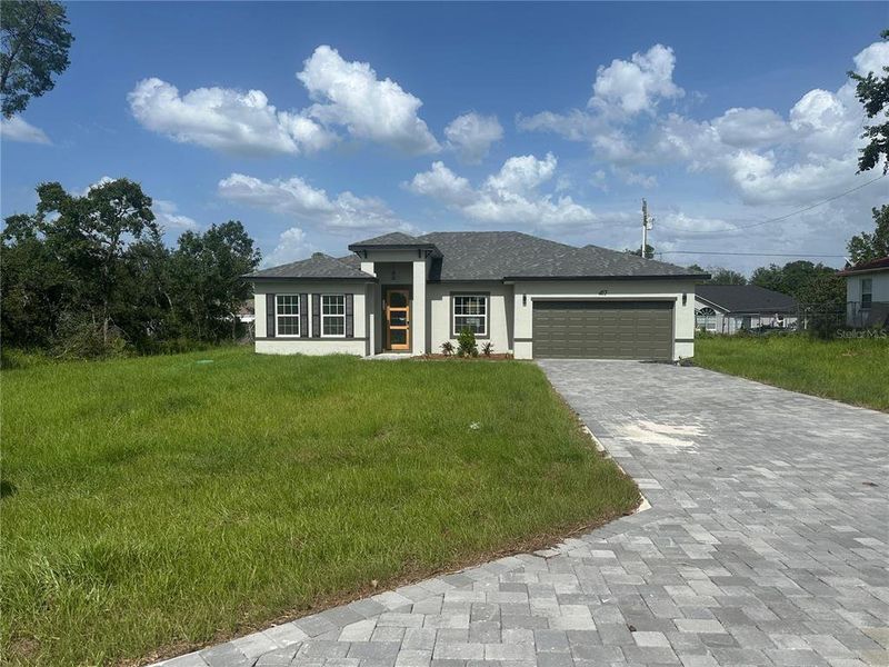 Front exterior of a new home in , Ocala, FL, highlighting curb appeal (Image 22).
