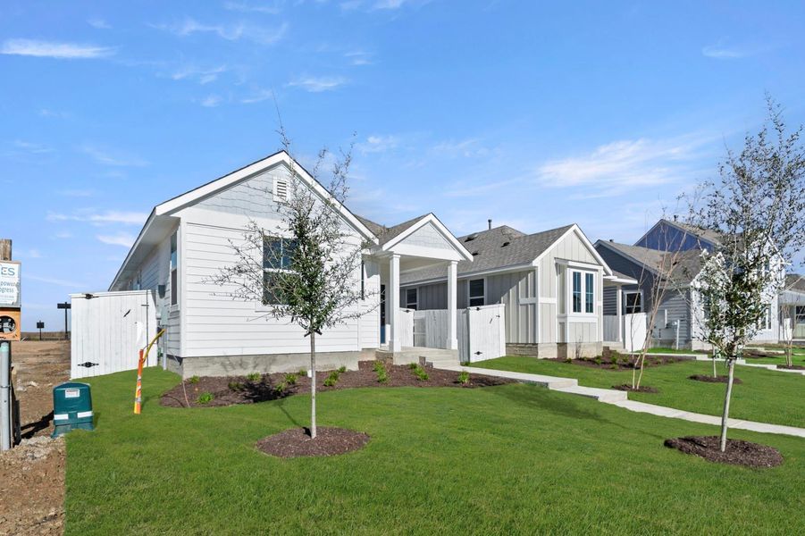Front exterior of a new home in Harvest Ridge, Elgin, TX, highlighting curb appeal (Image 1).