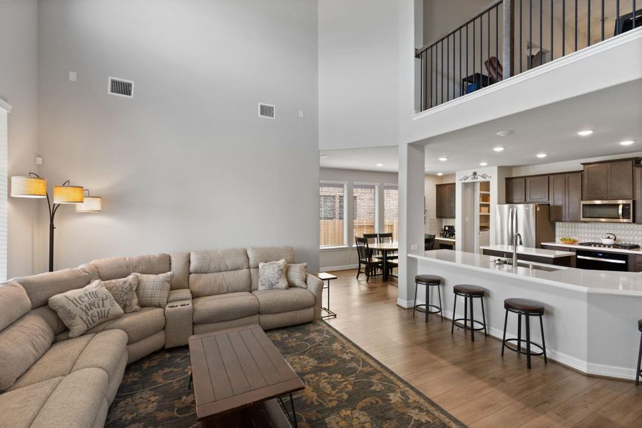 Family room with vaulted ceiling just off the kitchen.