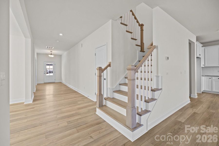 Lovely Stairs off Family RoomPhotos are representative and may not reflect the exact home, finishes, or features.