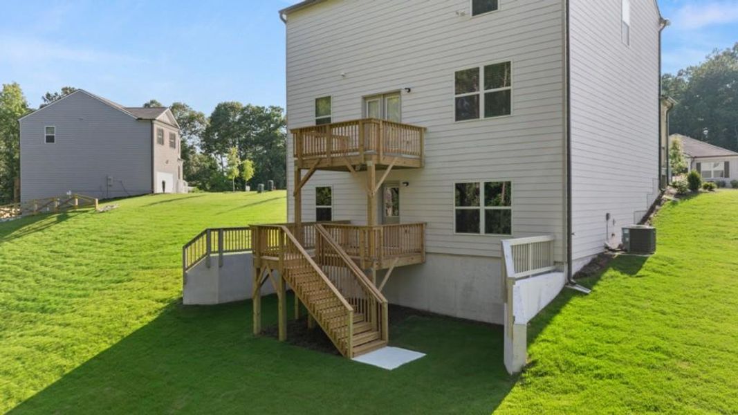 Exterior details and patio area of a home in Oaks at Cedar Grove, Fairburn (Image 3).