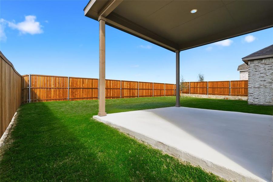 Fenced backyard with a patio Fenced backyard with a patio