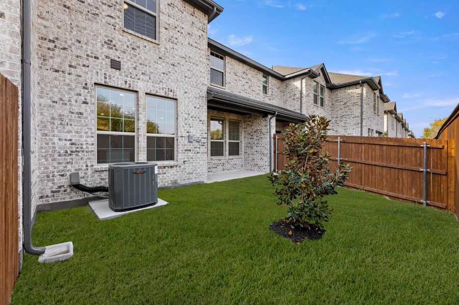 Front exterior of a new home in Main Street Village, Mansfield, TX, highlighting curb appeal (Image 27). Front exterior of a new home in Main Street Village, Mansfield, TX, highlighting curb appeal (Image 27).