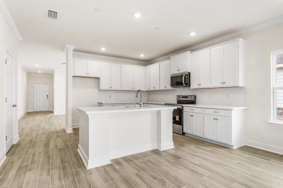 Furnished interior view inside a new home in Natureview, Freeport (Image 3).