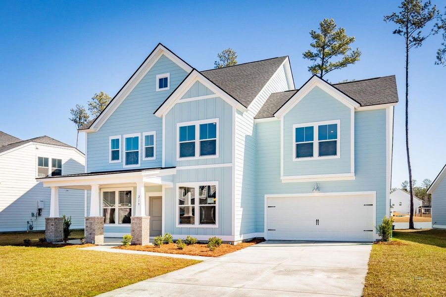 Front exterior of a new home in Waterside at Lakes of Cane Bay: Coastal Collection, Summerville, SC, highlighting curb appeal (Image 16).