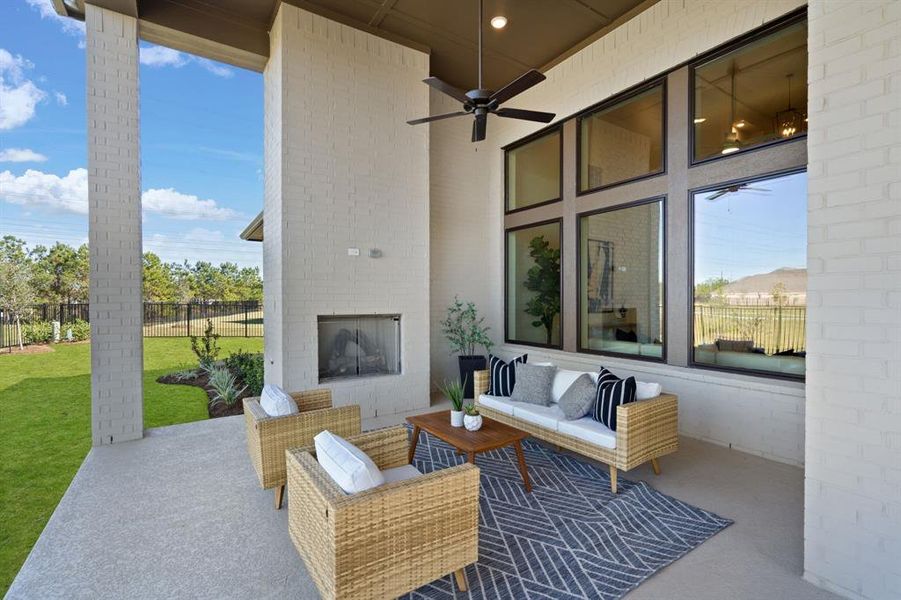 Oversized covered patio with beautiful gas fireplace, perfect for relaxing on a cool evening