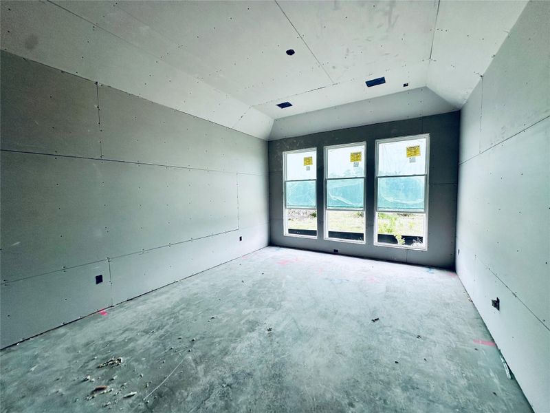 Primary Bedroom with elevated ceiling