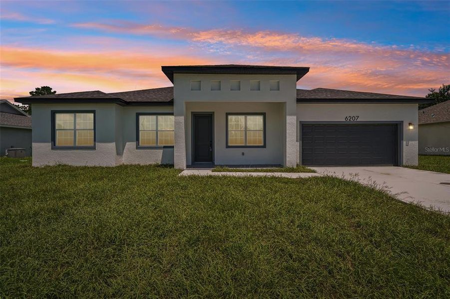 Front exterior of a new home in , Ocala, FL, highlighting curb appeal (Image 2). Front exterior of a new home in , Ocala, FL, highlighting curb appeal (Image 2).