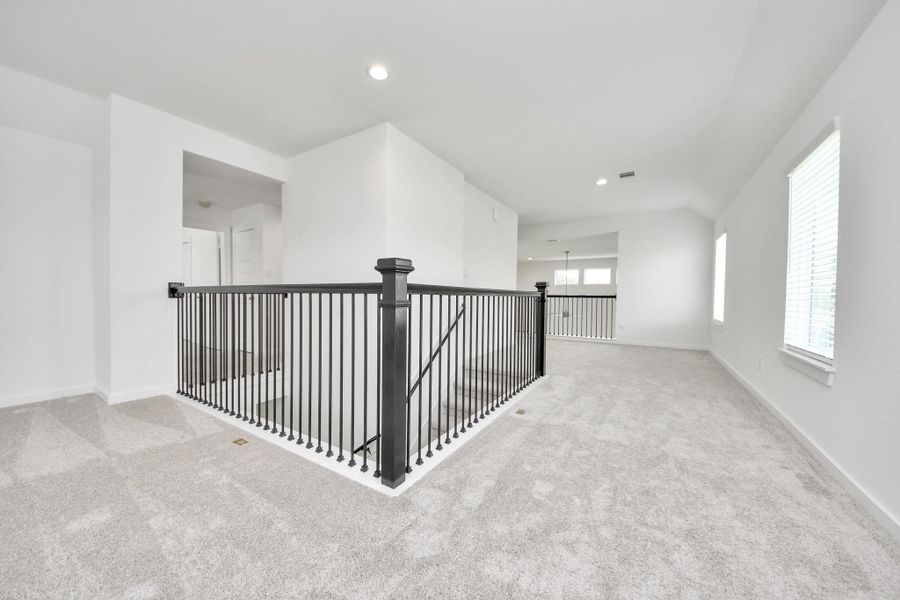 Ascend to relaxation in this fantastic game room! Ideal for both casual gatherings and adult gaming, it boasts plush carpet, lofty ceilings, custom paint, and ample windows for abundant natural light. Ascend to relaxation in this fantastic game room! Ideal for both casual gatherings and adult gaming, it boasts plush carpet, lofty ceilings, custom paint, and ample windows for abundant natural light.