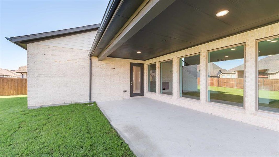 Exterior details and patio area of a home in Devonshire - Reserve 50', Forney (Image 3). Exterior details and patio area of a home in Devonshire - Reserve 50', Forney (Image 3).