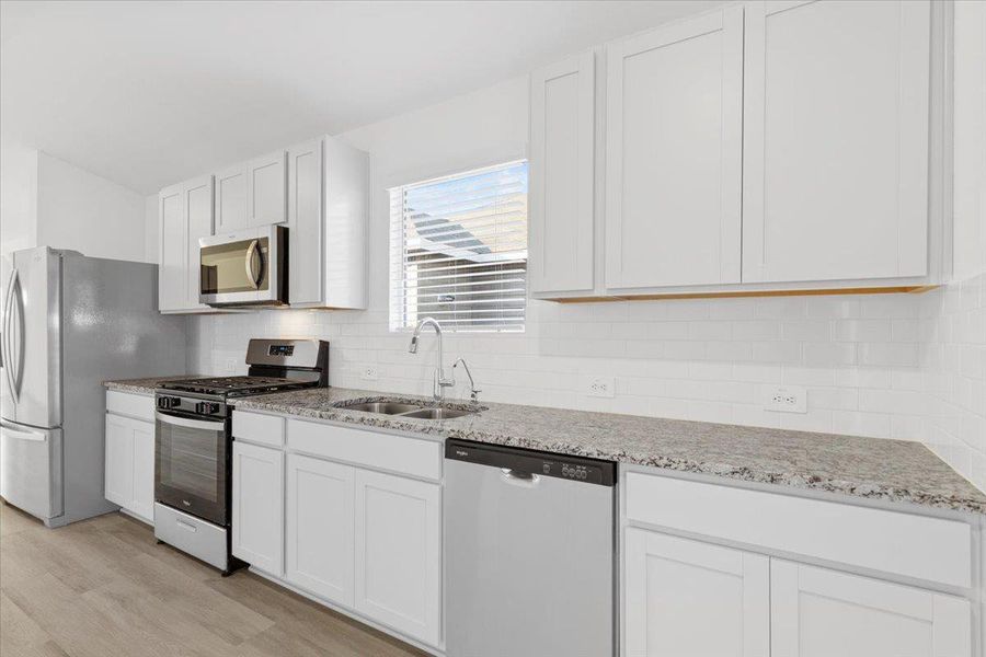 Furnished interior view inside a new home in Waterstone Crossing, Kyle (Image 6). Furnished interior view inside a new home in Waterstone Crossing, Kyle (Image 6).