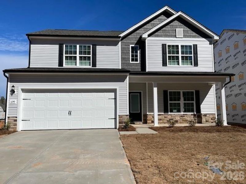 Front exterior of a new home in Knights Bridge, Richburg, SC, highlighting curb appeal (Image 1). Front exterior of a new home in Knights Bridge, Richburg, SC, highlighting curb appeal (Image 1).