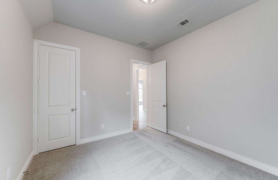 Representative unfurnished interior of a home built from the 3049 by Ravenna Homes in The Woodlands Hills 65′, Willis (Image 33). Representative unfurnished interior of a home built from the 3049 by Ravenna Homes in The Woodlands Hills 65′, Willis (Image 33).