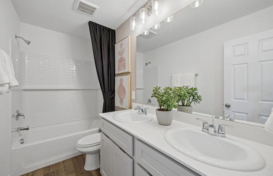 Representative furnished interior of a home built from the Camelia by Pulte Homes in Saddleback at Santa Rita Ranch, Liberty Hill (Image 16).