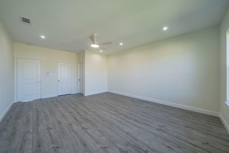 Unfurnished room featuring wood finished floors, recessed lighting, and a ceiling fan Unfurnished room featuring wood finished floors, recessed lighting, and a ceiling fan